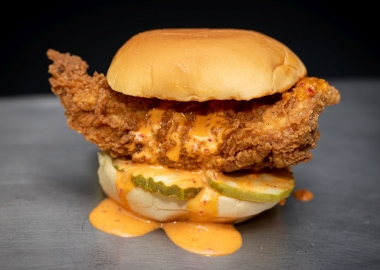 Fuku's spicy friend chicken sandwich with pickles and sauce (Photo: Clay Williams>
