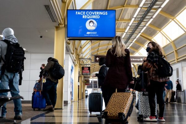 Passengers wait to go through security at Reagan National Airport on Feb. 24, 2021. (Photo: Erin Schaff/New York Times)