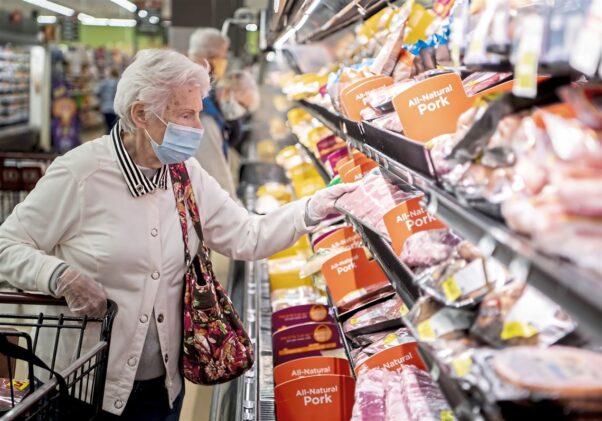 An elderly woman shops the meat department at a Giant Eagle in Ross Township, Pa., wearing a face covering. (Photo: Alexandra Wimley/Pittsburgh Post Gazette)