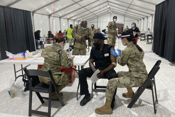 A black man receives his COVID-19 vaccination April 7, 2021 at the FEMA vaccination site at the Greenbelt Metro station. (Photo: FEMA Region 3)