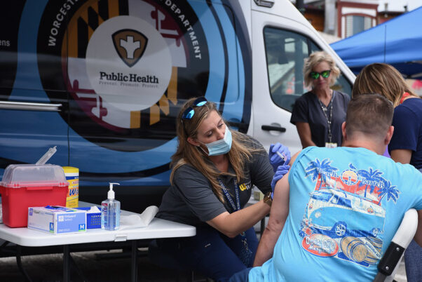 A man gets a COVID-19 vaccination from a nurse at a mobile clinic at Seacrets bar in Ocean City on May 28, 2021. (Photo: MdGovPics/Flickr)
