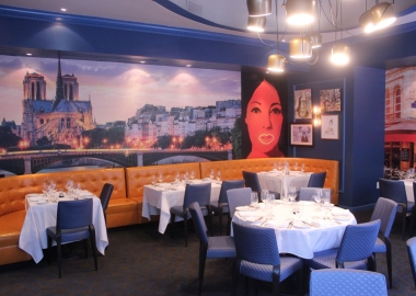 The private dining room with custom murals of Notre-Dame (left) and the Left Bank (right). (Photo: Mark Heckathorn/DC on Heels)