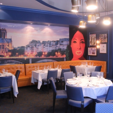 The private dining room with custom murals of Notre-Dame (left) and the Left Bank (right). (Photo: Mark Heckathorn/DC on Heels)