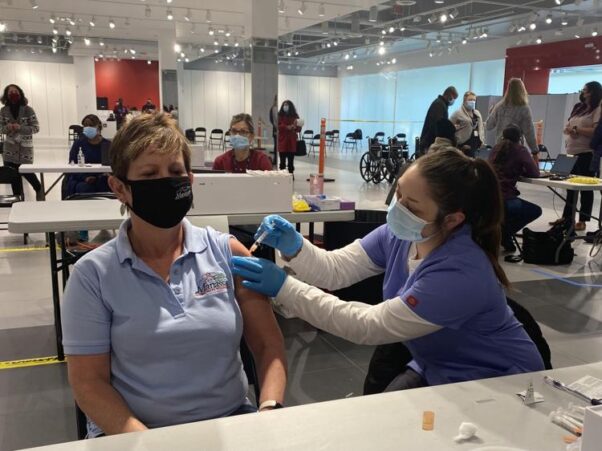A woman gets a COVID-19 vaccination at the Manassas Mall on Feb. 20, 2021. (Photo: Jill Palermo/Prince William Times)