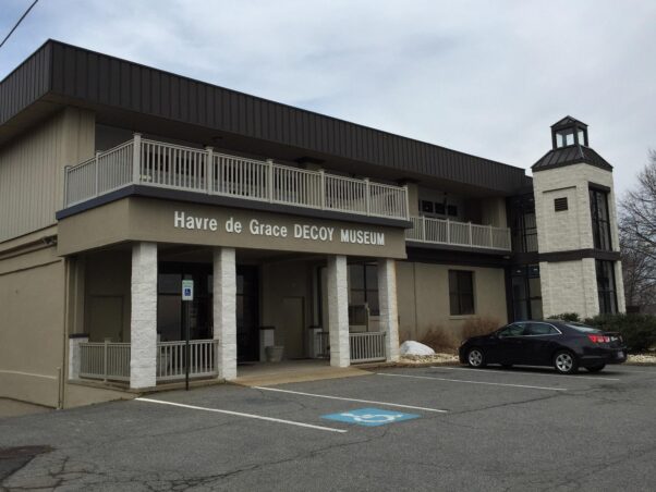The exterior of the two-story, beige Decoy Museum from the parking lot. (Photo: Cornelius James)