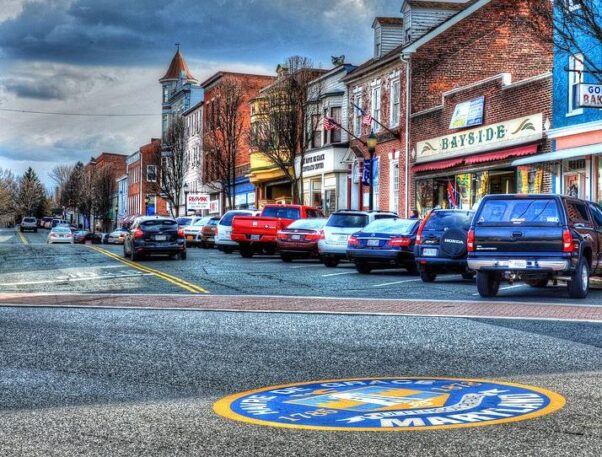 A street in Downtown Havre de Grace lined with stores including Bayside and Gold's Bakery with cars parked in front of the shops. (Photo: Debbi 
Granruth)