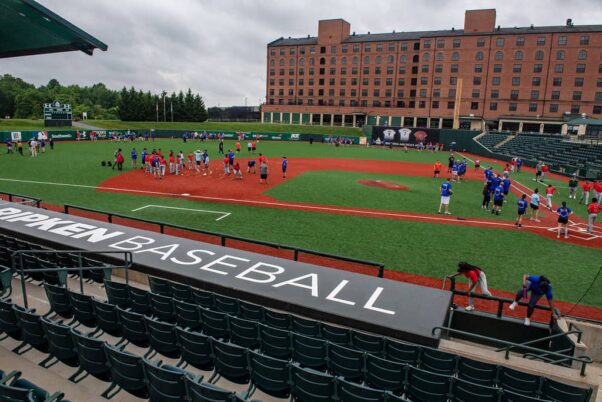 People on the field at Ripken Stadium with a dugout in the forefront. (Photo: U.S. Marshals Service/Flickr)