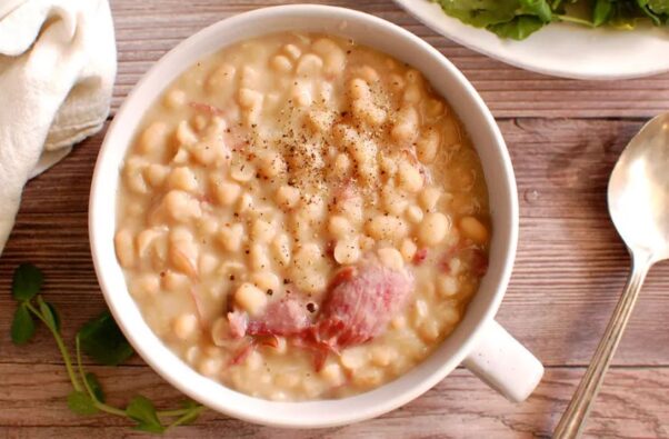 A white bowl filled with Senate Bean Soup and chunks of smoked ham hock. (Photo: Contributed)