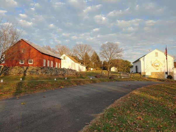 view of Steppingstone Farm Museum's buildings including the red office building (l to r), white blacksmith building and white wood and stone Display Barn, which burned june 2. (Photo: Steppingstone 
farm Museum/Facebook)