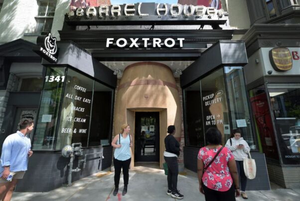 The outside of the former Foxtrot Market in Logan Circle with the beer barrel front and customers standing outside. (Photo: Matt McClain/The Washington Post)