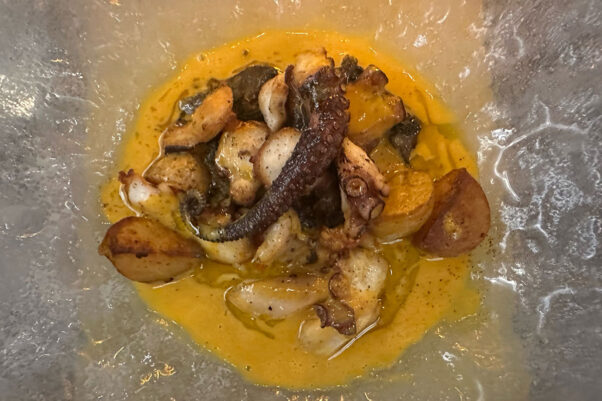 Spice-crusted octopus at Elyse on a frosted glass plate with a tentacle in the middle. (Photo: Alice Levitt)
