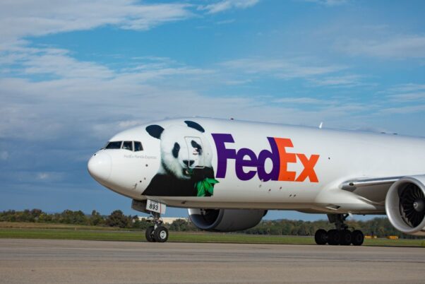 FedEx's Panda Express, a Boeing 777F airplane with a panda eating bamboo painted on the front, the words Panda Express and the purple and orange FedEx logo behind the panda. (Photo: FedEx)