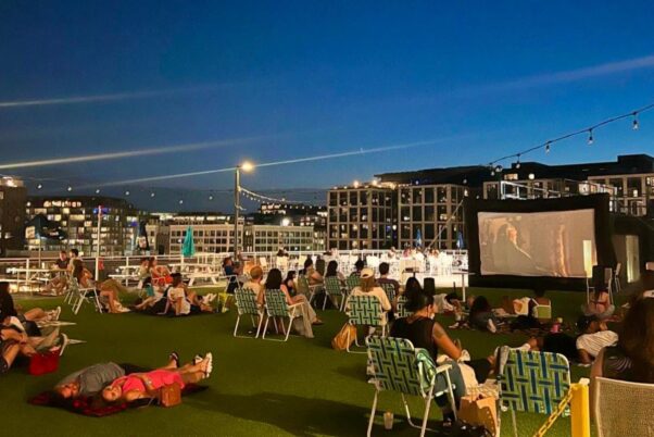 People sitting on lawn chairs and laying on blankets watching a movie at Hi-Lawn on the roof of Union Market. (Photo: Hi-Lawn)