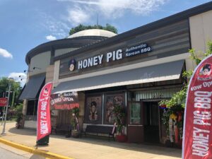 The exterior of Honey Pig Korean BBQ in Rockville in 2018 with with grand opening and now open signs out front. (Photo: Honey Pig/Facebook)