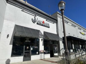 Exterior of Japomen with black awnings and sign. (Photo: Angela Woolsey)