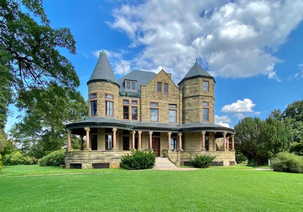 Exterior of Maymont Mansion with a wrap-around porch and two turrets in front. (Photo: Maymont)