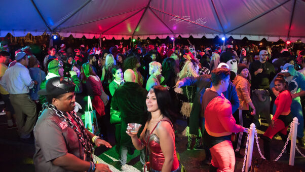 Adults dressed in costumes dance in a tent to a DJ. Night of the Living Zoo, a 21-and-over party, happens Oct. 20 at the National Zoo. (Photo: Jim Jenkins/Friends of the National Zoo)