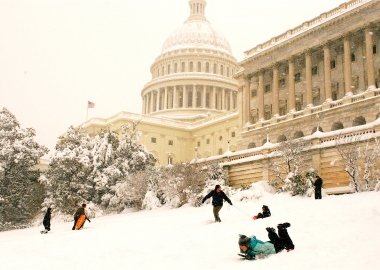 Kids sledding down the hill in front of the U.S. Capitol. (Photo: Val H/Flickr)