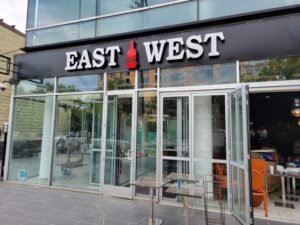 Exterior of East West Cafe in Tenleytown in the daylight. (Photo: PoPville)