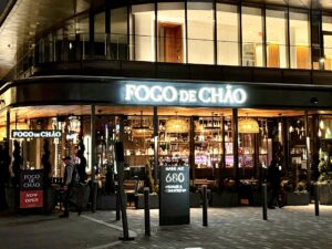 Exterior of Fogo de Chao at night with the white letters lit up. (Photo: The Wharf/Facebook)