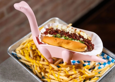 Chili dog served in a Brontosaurus figurine walking through fries. (Photo: Joy Asico)