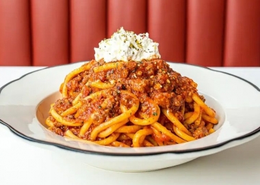 Spaghetti with meat sauce topped with parmesan cheese. (Photo: Caruso's Grocery)
