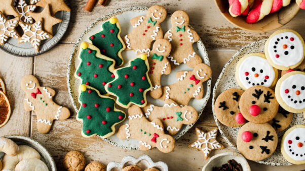 Top view of variety of gingerbread cookies presented on festive table for Christmas celebration. (Photo: alvarez/iStock)