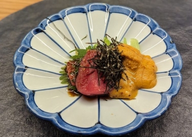 Sashimi trio in a blue and white flower-shaped bowl. (Photo: Amol W./Yelp)