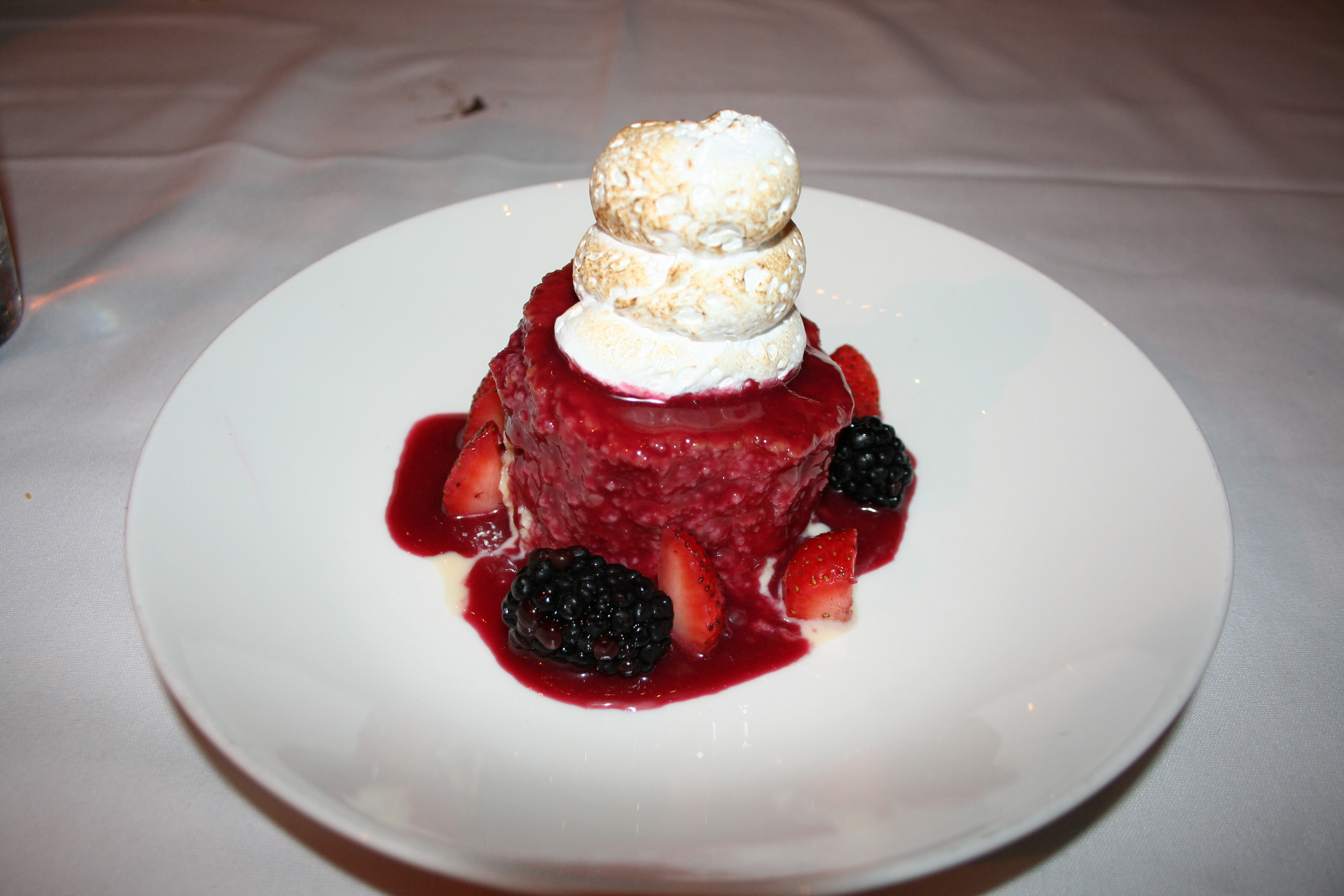 Tres leches con zarzamoras: Sour cream pound cake soaked in three milks and covered with blackberry-hibiscus glaze. (Photo: Mark Heckathorn/DC on Heels)