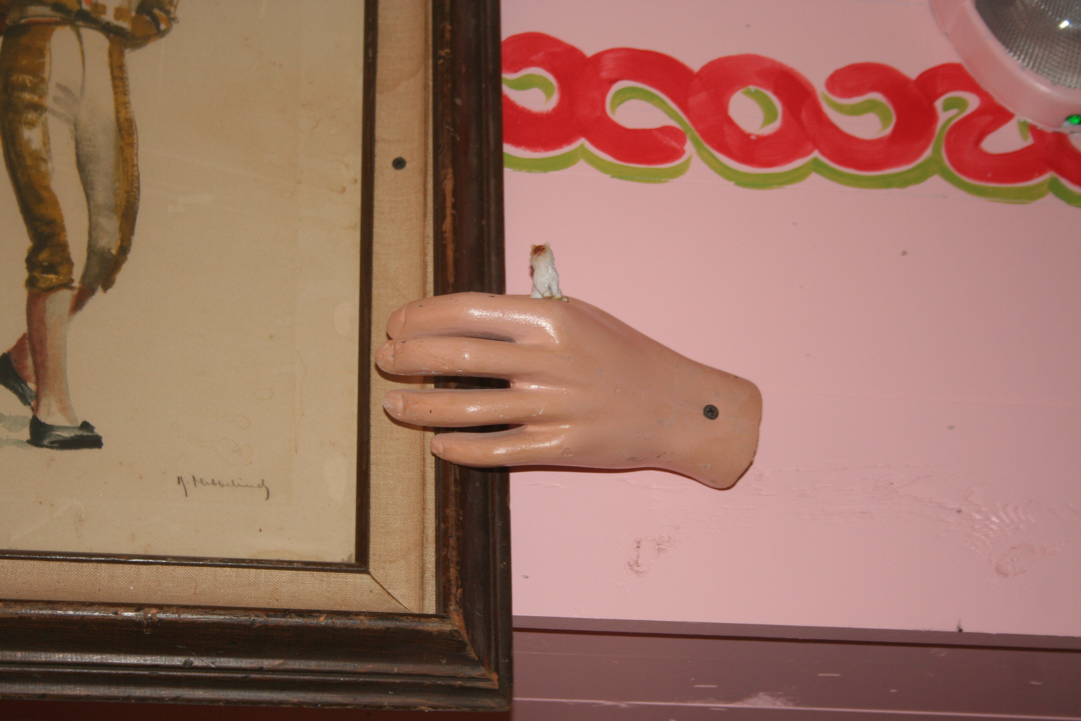 There are 24 miniature cats  including this one hidden throughout the restaurant. (Photo: Mark Heckathorn/DC on Heels)