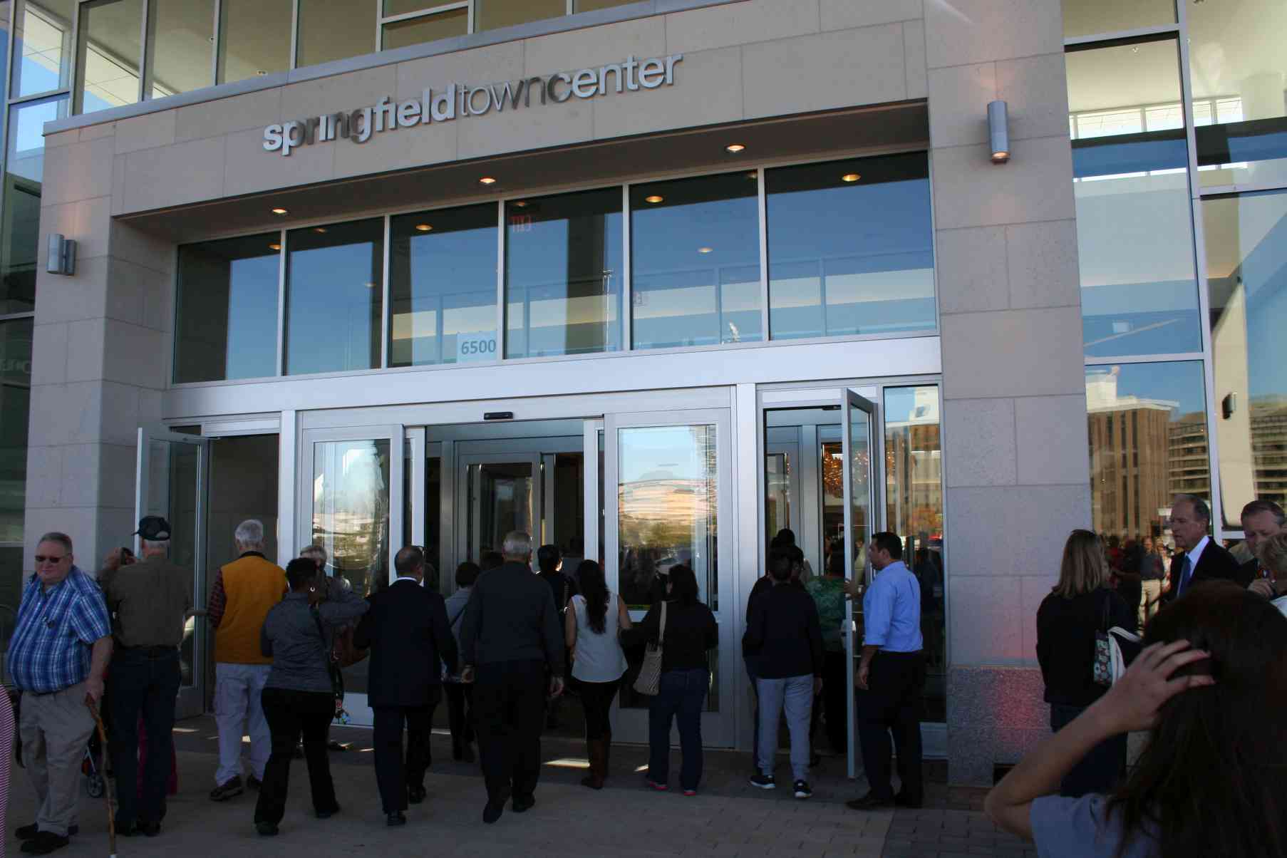 Hundred of shoppers stream into the new mall after the ribbon cutting. (Photo: Mark Heckathorn/DC on Heels)