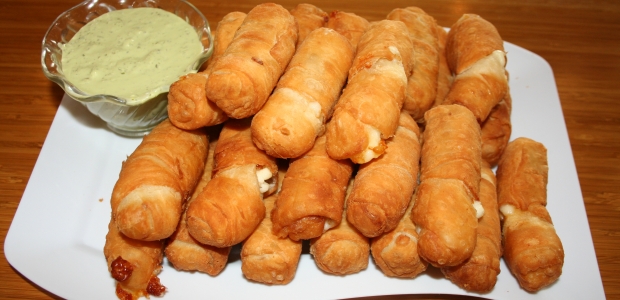 Tequeños are delicious cheese sticks served with a garlic-cilantro sauce. (Photo: Mark Heckathorn/DC on Heels)