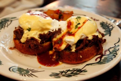 Columbus Day brunch at Commissary includes a pulled pork benedict on a cornbread muffin with BBQ hollandaise sauce. (Photo: Commissary/Facebook)