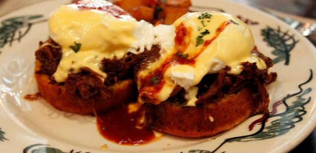 Columbus Day brunch at Commissary includes a pulled pork benedict on a cornbread muffin with BBQ hollandaise sauce. (Photo: Commissary/Facebook)
