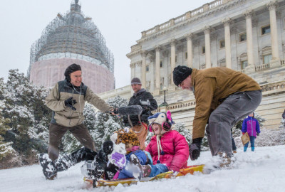 Sledders slide down the hill in front of the U.S. Capitol Building. (Photo: Joseph Gruber)