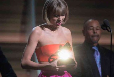 Taylor Swift accepts the Album of the Year Grammy. (Photo: Kevork Djansezian/WireImage)